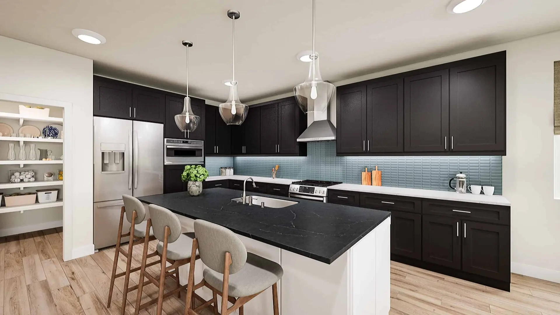 A kitchen with black cabinets and white island.