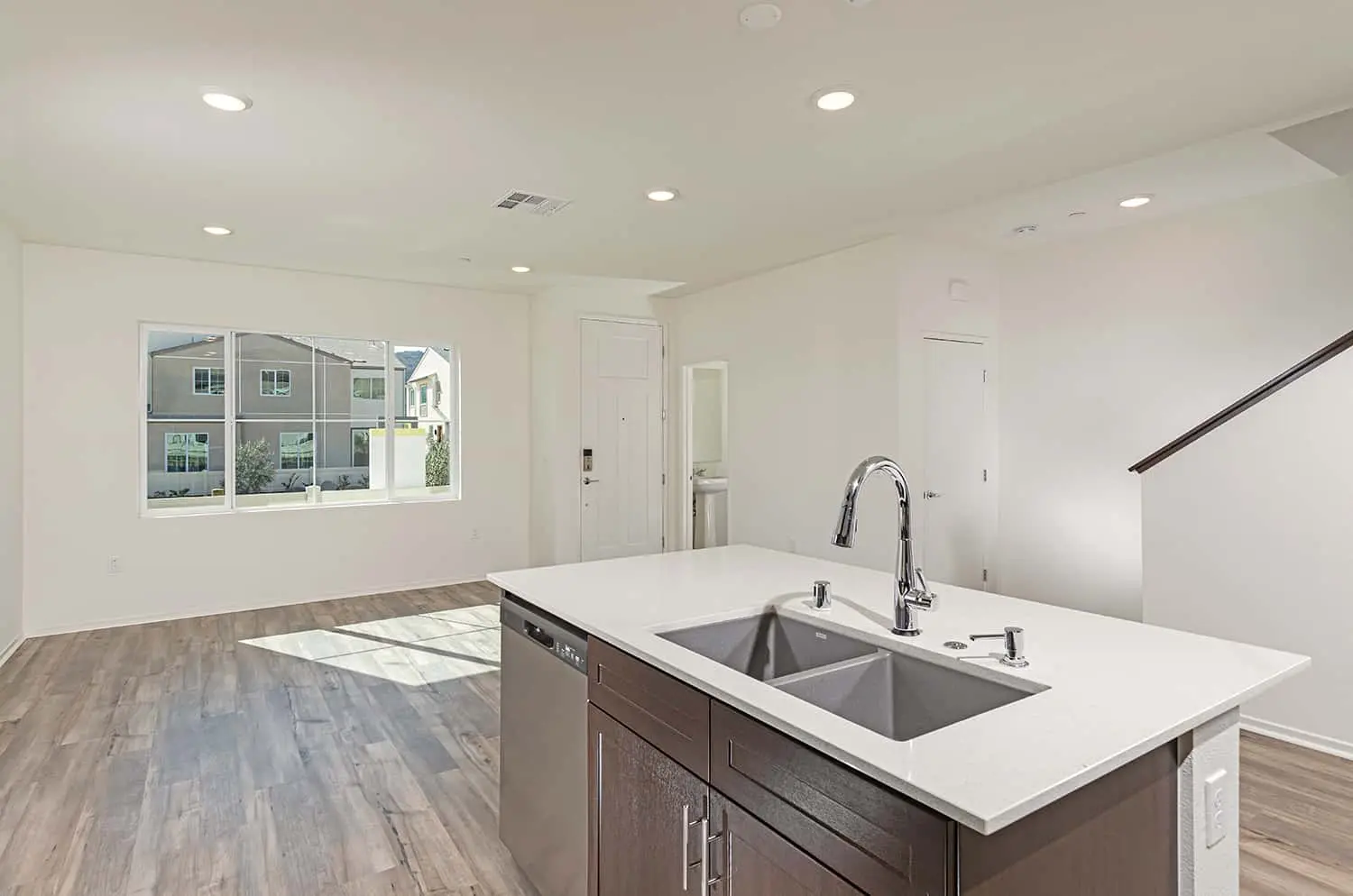 A kitchen with an island and sink in it