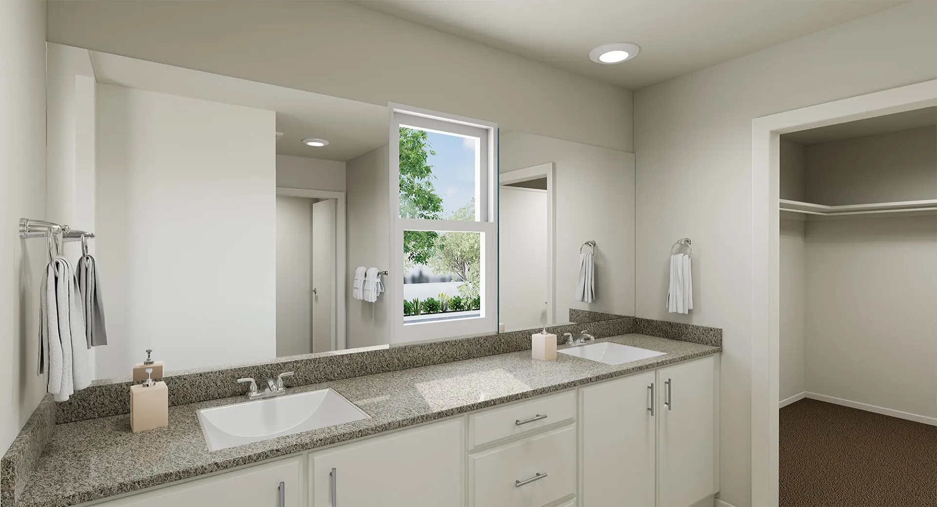 A bathroom with two sinks and a large mirror.