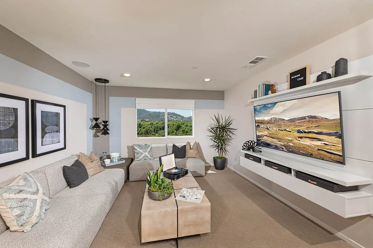 A living room with couches and a television.