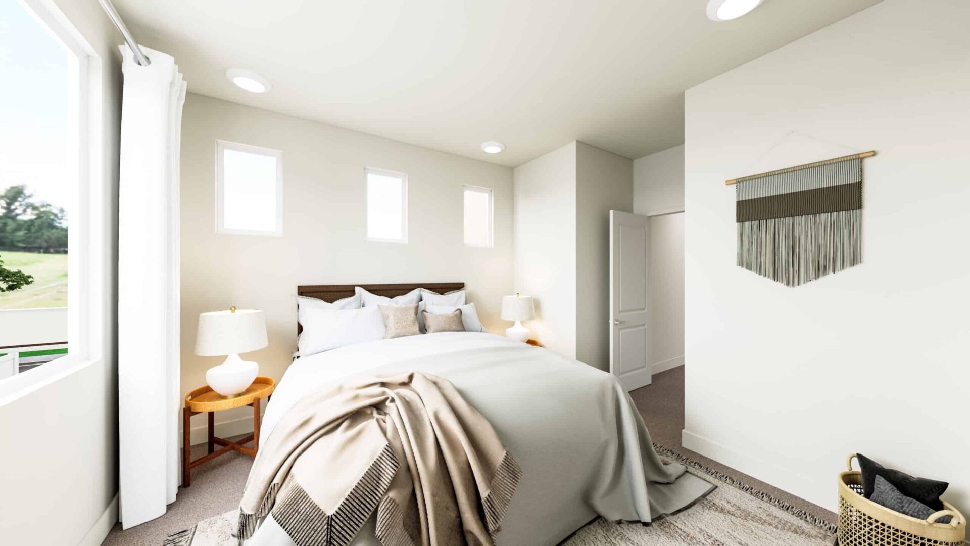 A bedroom with white walls and wooden floors.